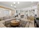 Open-concept living area showcasing a large sectional sofa connecting to the dining and kitchen at 1623 Hoyt Ave, Indianapolis, IN 46203
