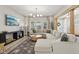 Bright and open living room featuring a large sectional sofa and modern decor at 1623 Hoyt Ave, Indianapolis, IN 46203