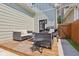 Charming backyard patio with stylish furniture and a modern grill at 1623 Hoyt Ave, Indianapolis, IN 46203