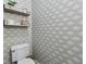 Stylish powder room adorned with patterned wallpaper and a modern toilet at 1623 Hoyt Ave, Indianapolis, IN 46203