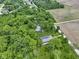 Overhead shot showcasing the secluded home nestled within a densely wooded landscape at 17320 Joliet Rd, Westfield, IN 46074