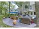 Expansive backyard patio with elegant outdoor furniture, umbrellas, and views of the landscaped yard at 17320 Joliet Rd, Westfield, IN 46074