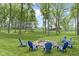 Backyard gathering space with fire pit and chairs, home and barn in the background at 17320 Joliet Rd, Westfield, IN 46074