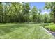 A lush, green backyard offers plenty of space for recreation and relaxation at 17320 Joliet Rd, Westfield, IN 46074