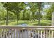View of gorgeous backyard featuring lush lawn, mature trees and expansive outdoor entertaining space at 17320 Joliet Rd, Westfield, IN 46074