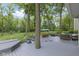Spacious backyard featuring a large deck, outdoor furniture, and beautiful landscaping at 17320 Joliet Rd, Westfield, IN 46074