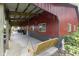 Exterior view of the barn's covered porch, featuring a swing at 17320 Joliet Rd, Westfield, IN 46074