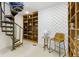 Finished basement with a spiral staircase, custom wood shelving, and unique design features at 17320 Joliet Rd, Westfield, IN 46074