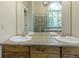 Bathroom featuring double sinks, vanity, glass enclosed shower and soaking tub at 17320 Joliet Rd, Westfield, IN 46074