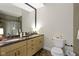 Modern bathroom featuring double sinks, a tiled shower, and a neutral color scheme at 17320 Joliet Rd, Westfield, IN 46074