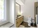 Well-lit bathroom featuring a neutral color scheme, a tiled shower, and a vanity with ample counter space at 17320 Joliet Rd, Westfield, IN 46074