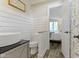 Modern bathroom with a wooden counter, a toilet, an unusual sink and wood-patterned floors at 17320 Joliet Rd, Westfield, IN 46074