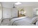 Comfortable bedroom with closets, ceiling fan, light walls, light-colored wooden floor and skylight at 17320 Joliet Rd, Westfield, IN 46074