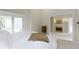 A bedroom with a fireplace and a door to a private balcony at 17320 Joliet Rd, Westfield, IN 46074
