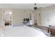 Comfortable bedroom featuring a ceiling fan, a workspace and a convenient closet for storage at 17320 Joliet Rd, Westfield, IN 46074