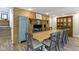 Open-concept dining room with fireplace, wood floors and blue cabinet at 17320 Joliet Rd, Westfield, IN 46074