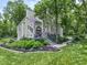 Charming two-story home with landscaped yard and a beautiful porch, perfect for relaxing outdoors at 17320 Joliet Rd, Westfield, IN 46074