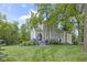 Charming two-story home with landscaped yard and a beautiful porch, perfect for relaxing outdoors at 17320 Joliet Rd, Westfield, IN 46074
