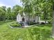 Attractive two-story home featuring an inviting front porch and beautifully landscaped yard at 17320 Joliet Rd, Westfield, IN 46074