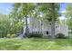 Charming two-story home with landscaped yard and a beautiful porch, perfect for relaxing outdoors at 17320 Joliet Rd, Westfield, IN 46074