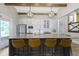 This modern kitchen has an island with seating and bright lighting at 17320 Joliet Rd, Westfield, IN 46074