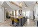 Open-concept kitchen showcases a large island with seating and a view of the dining area at 17320 Joliet Rd, Westfield, IN 46074