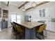 Spacious kitchen features a large island with seating, stainless steel appliances, and stylish pendant lighting at 17320 Joliet Rd, Westfield, IN 46074