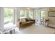 Sunroom featuring large windows and comfortable seating with an area rug at 17320 Joliet Rd, Westfield, IN 46074