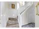 Bright stairway features white railings and wood steps with easy access to the upper levels at 17320 Joliet Rd, Westfield, IN 46074
