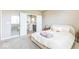 Bright bedroom features plush carpet, an accent mirror, and ensuite bathroom with a modern design at 1758 Pelham Dr, Greenwood, IN 46143