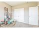 Spare room/office features grey carpet, a book shelf and a large closet ready for your imagination! at 1758 Pelham Dr, Greenwood, IN 46143
