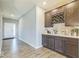 Hallway featuring a service bar with a built-in wine rack and a beautiful countertop and backsplash at 1758 Pelham Dr, Greenwood, IN 46143