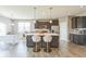 Stylish kitchen featuring a large center island, modern stainless steel appliances, and counter seating at 1758 Pelham Dr, Greenwood, IN 46143