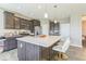 Stylish kitchen featuring a large center island, modern stainless steel appliances, and counter seating at 1758 Pelham Dr, Greenwood, IN 46143