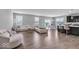 Spacious living room featuring contemporary furniture and an open layout concept to the kitchen and dining areas at 1758 Pelham Dr, Greenwood, IN 46143