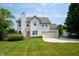 Well-maintained two-story home with a deck, attached garage, and a spacious manicured lawn at 17877 Kinder Oak Dr, Noblesville, IN 46062