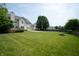 Expansive backyard with lush green grass and mature trees, ideal for outdoor activities and relaxation at 17877 Kinder Oak Dr, Noblesville, IN 46062
