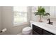 Half-bath features a vanity with sink, toilet and window with natural light at 17877 Kinder Oak Dr, Noblesville, IN 46062