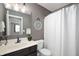 Bathroom features a vanity with sink, toilet, and shower with white shower curtain at 17877 Kinder Oak Dr, Noblesville, IN 46062