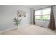 Serene bedroom featuring soft carpet, neutral paint, and a bright window at 17877 Kinder Oak Dr, Noblesville, IN 46062