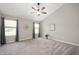 Primary bedroom featuring vaulted ceiling, neutral colors, carpet and many windows at 17877 Kinder Oak Dr, Noblesville, IN 46062