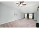 Spacious bedroom features carpet, a ceiling fan, and natural light from windows at 17877 Kinder Oak Dr, Noblesville, IN 46062