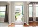 Open foyer showcasing hardwood floors and a view of the front yard at 17877 Kinder Oak Dr, Noblesville, IN 46062