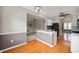 Eat-in kitchen view showcases hardwood floors and open layout to adjoining rooms at 17877 Kinder Oak Dr, Noblesville, IN 46062