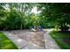 Community playground featuring slides, swings, and climbing structures, surrounded by trees and green space at 17877 Kinder Oak Dr, Noblesville, IN 46062