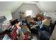 Cluttered attic space filled with boxes and personal belongings, lit by a single window at 1809 E 13Th St, Muncie, IN 47302