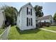 Exterior view of a two-story home featuring white siding and black shutters at 1809 E 13Th St, Muncie, IN 47302