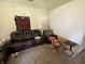Cozy living room with leather sofa and wooden table at 1809 E 13Th St, Muncie, IN 47302
