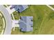 Overhead aerial view showcasing the home's layout, roofline, and lush surroundings at 19387 Astoria Ave, Sheridan, IN 46069