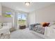 This bedroom includes a TV, a closet, a window with a view, and a vanity desk at 19387 Astoria Ave, Sheridan, IN 46069